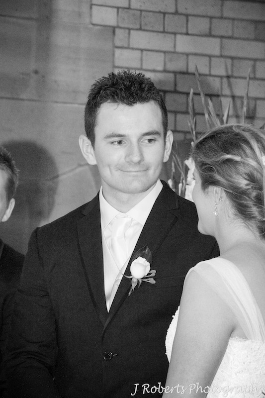 Groom looking at this bride while they say their vows - wedding photography sydney